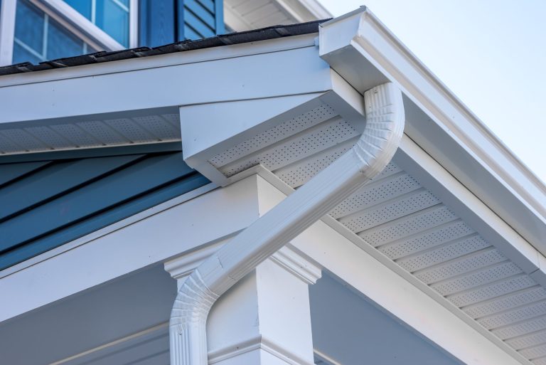 modern k-style white gutter with downspout